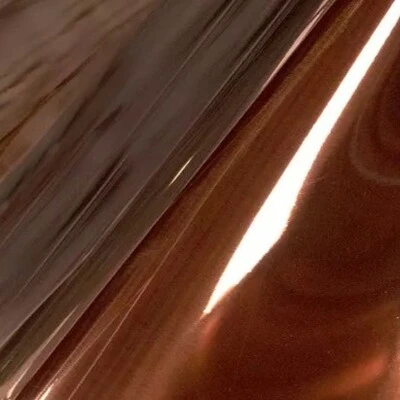 A close-up of a bright, reflective copper surface with a glossy finish, showcasing Koket's Bright Copper (Gloss) finish.