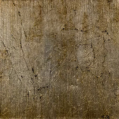 Close-up Broken Silver Leaf: irregular surface in pale silver tones with dark cracks and flaked areas, suggesting aged and fragmented silver leaf.