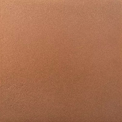 Close-up Copper Powder: fine and uniform surface in matte copper tones, with a slightly granular texture.