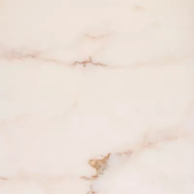 Close-up Estremoz Marble: light white marble with soft veins in shades of beige and pale pink, featuring a polished surface.