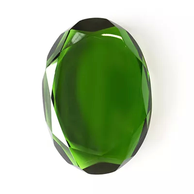 Close-up Gem Red: a faceted green gemstone with an intense shine and sharp reflections, on a white background.