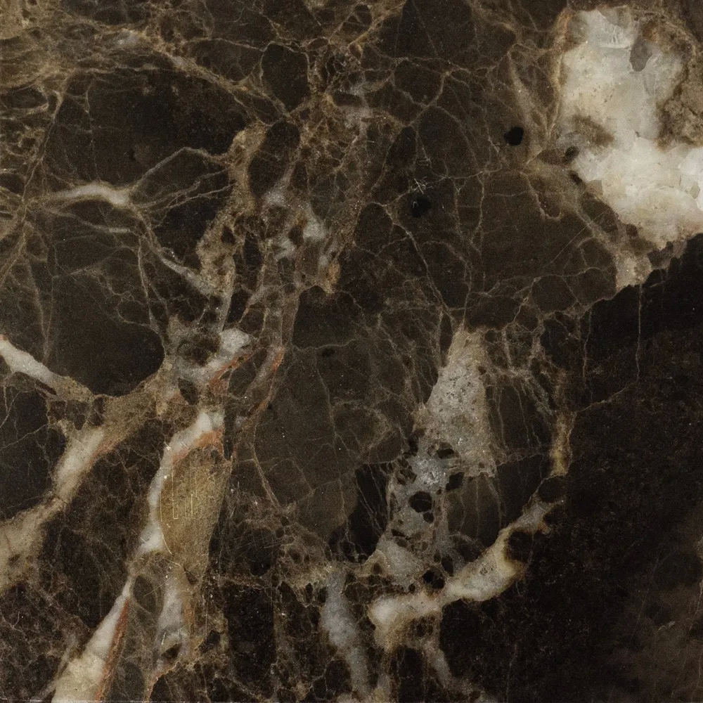 Close-up New Imperador Marble: dark brown marble with irregular white and golden veins, featuring a polished and glossy texture.