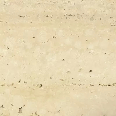 Close-up Travertine: light beige natural stone surface with soft horizontal bands in lighter and darker tones. Features pores and small cavities characteristic of travertine, with a natural matte finish.