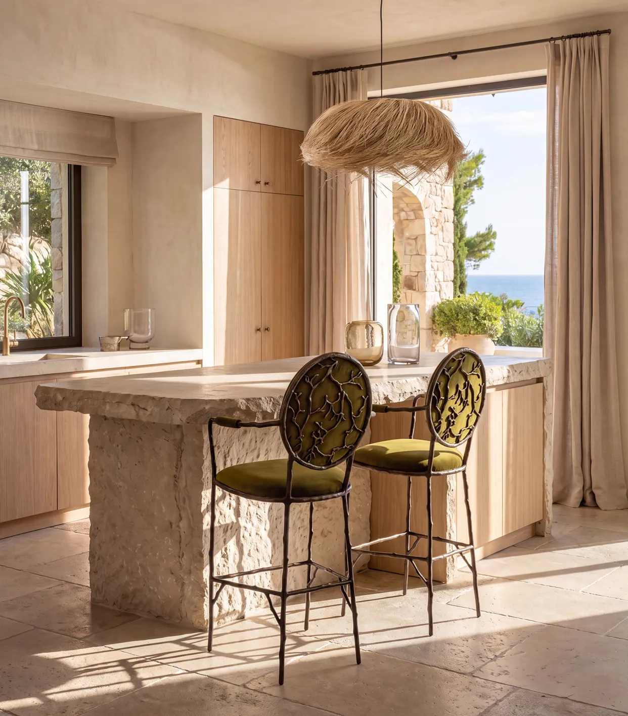 KOKET Enchanted Bar Stools with gilded branch frames at a kitchen island in a luxury interior.