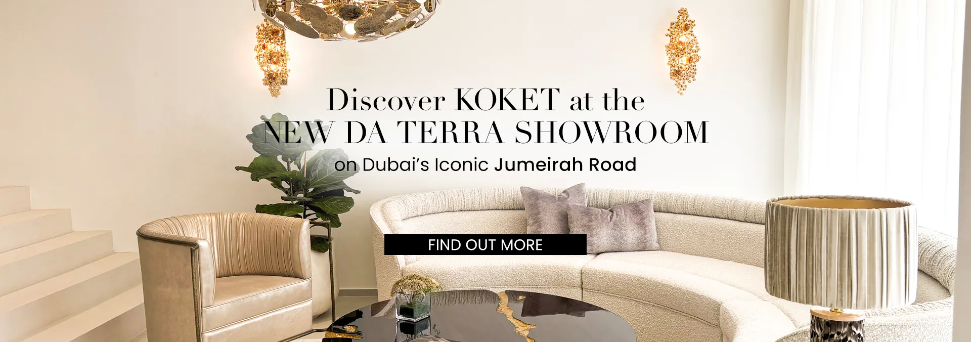 A wide-angle view of the new KOKET and DA TERRA luxury furniture showroom in Dubai on Jumeirah Road, featuring a curved bouclé sofa, a gilded armchair, and ornate golden lighting fixtures.