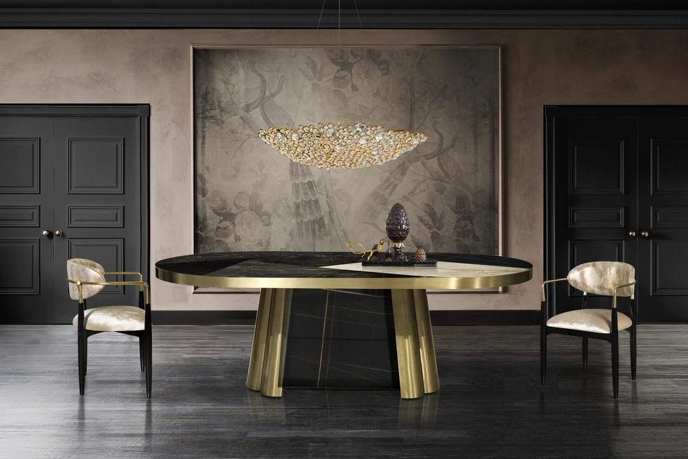 Step into a realm of refined luxury where golden hues radiate warmth and sophistication. The centerpiece, a magnificent Decodiva Dining Table with delicate golden accents, harmonizes with the soft, golden tones of the Nahéma Dining Chair and the Eternity Demi-Lune Chandelier, capturing the essence of artisanal craftsmanship and creating an ambiance that is both inviting and stylish.