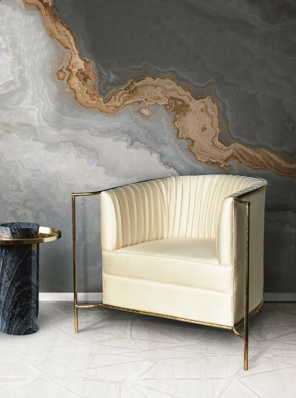 Desire Chair by KOKET featuring pleated cream satin upholstery, gold metal frame, and modern silhouette beside a marble side table and stone-inspired wallpaper