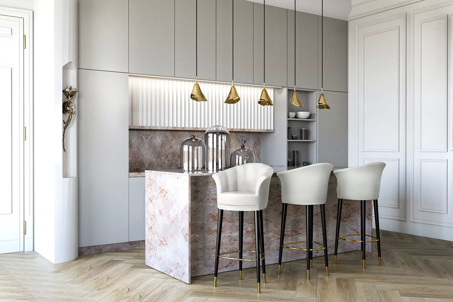A simple kitchen, in bright and soft hues, with a center island in marble, bringing classiness to the space. The golden details in the Gia Pendant and Flora Sconce, with floral motifs, enhance the elegance, combining with the Besame Bar Stools, upholstered in creamy white.