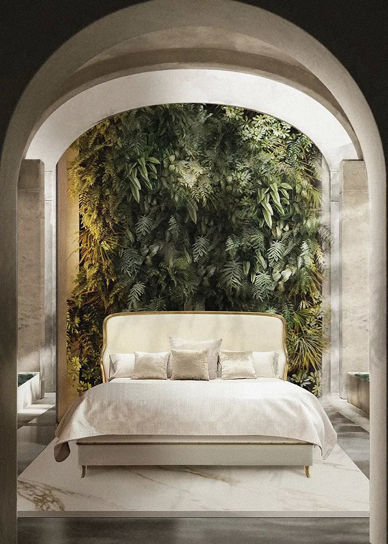 A grand bedroom features the Forbidden Plisse Bed by Koket, set against a lush green wall within elegant arched architecture.