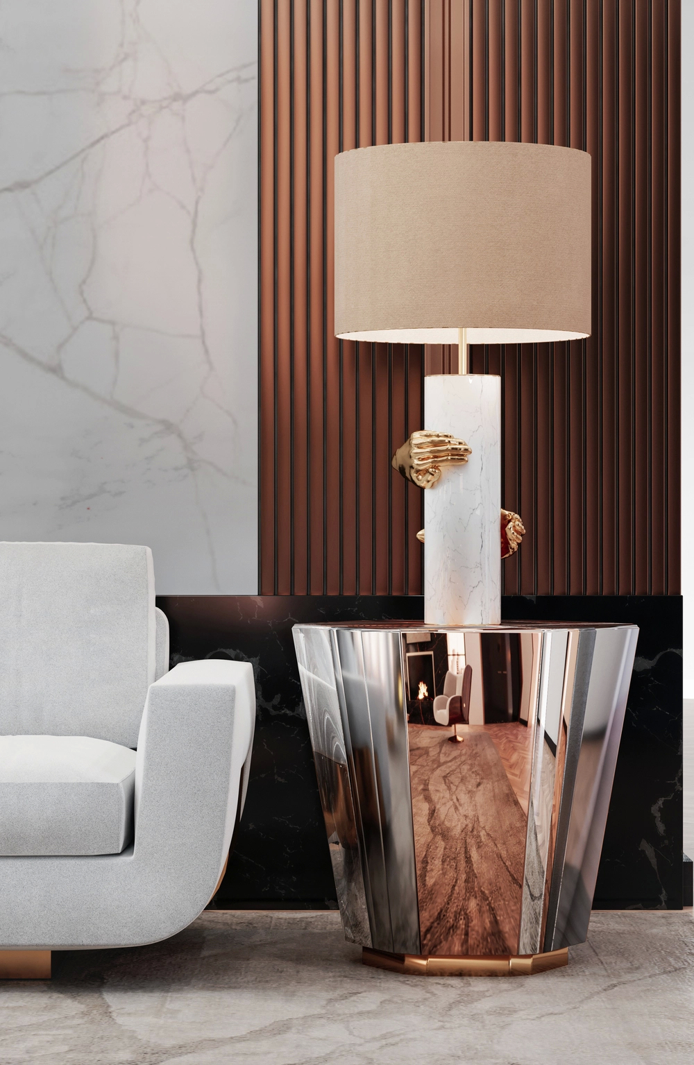 Elegant living room corner featuring the Sofia Sofa, a reflective metallic Lemprica side table, and a striking Vengeance table lamp with golden hands wrapped around a white marble base, set against a backdrop of ribbed bronze wall panels and marble accents.