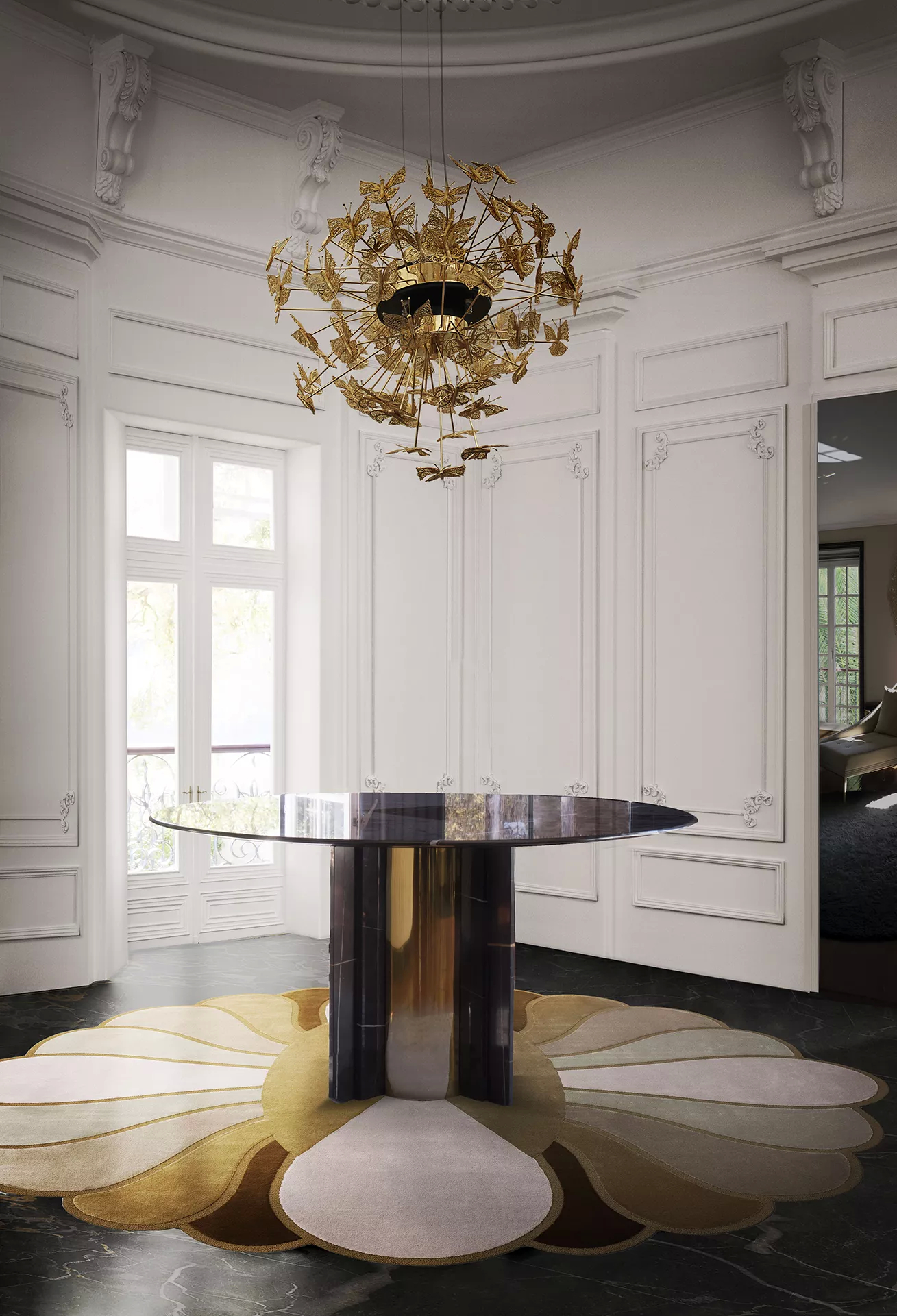 An entryway in neutral colors, with a black marble Paris Dining Table, featuring golden details, in the center of the space, anchoring the elegance that unfolds around it. Above, the golden Nymph Chandelier floats, captivating the attention with its delicate butterflies.