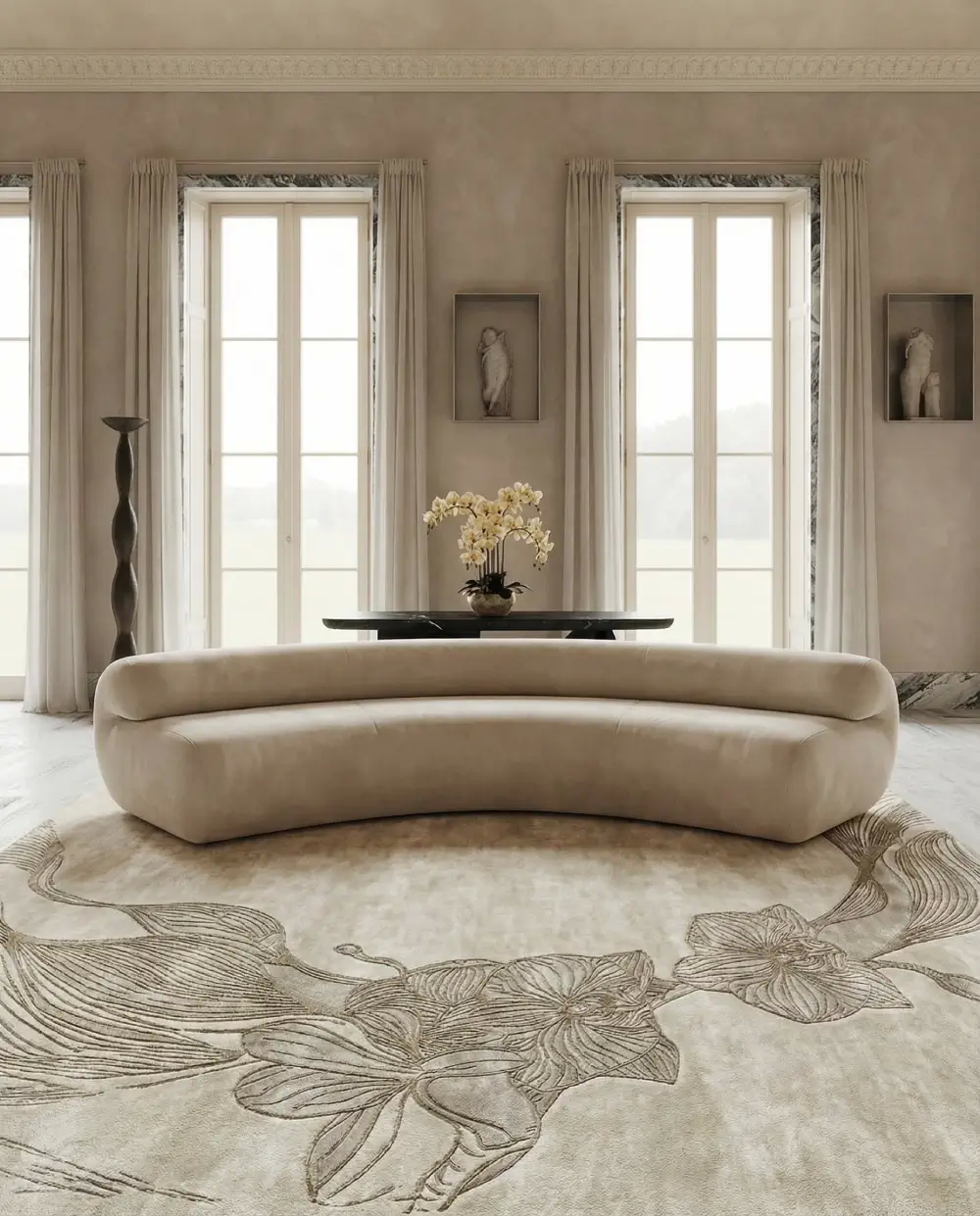 Taupe luxury living room featuring the Orchid Taupe Rug by KOKET with sculptural orchid pattern, curved cream sofa and elegant neutral interior design.