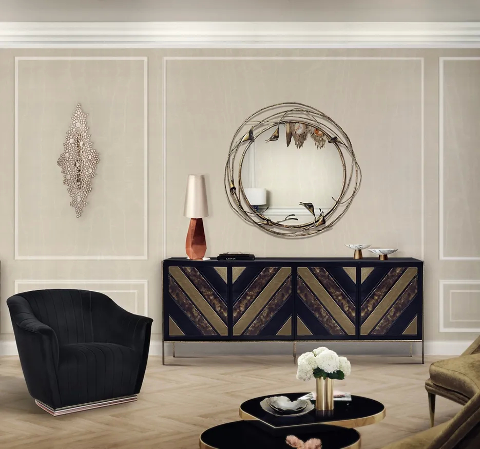 A lavish room features a black Opium Cabinet by Koket, a unique Stella Mirror, and a gold Eternity Sculpture.