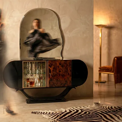 KOKET Women Art Deco luxury chest with organic mirror, illuminated glass display and sculptural black lacquer silhouette in a refined interior.