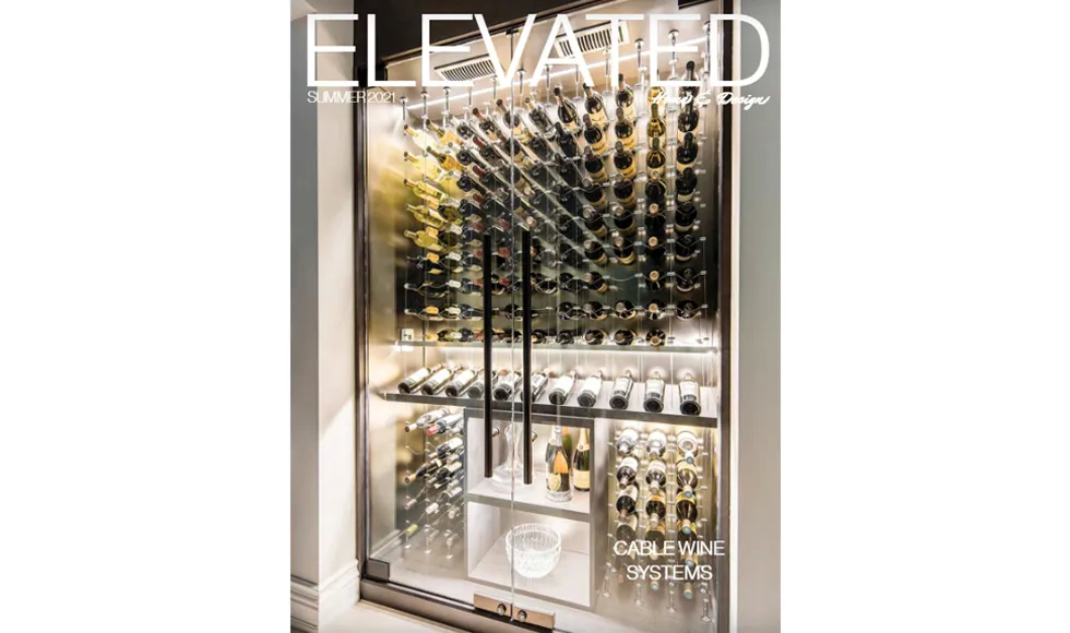 Elevated press clipping, the cover, featuring a large, modern wine cellar with many bottles.