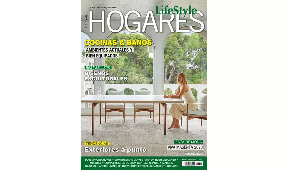 LifeStyle Hogares magazine cover featuring a woman seated at an outdoor dining table with lush greenery and architectural arches.