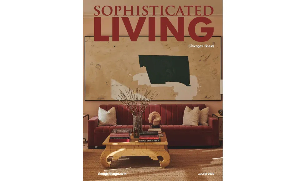 Sophisticated Living magazine cover featuring a living room with a red velvet sofa, a light wood coffee table, and abstract art.