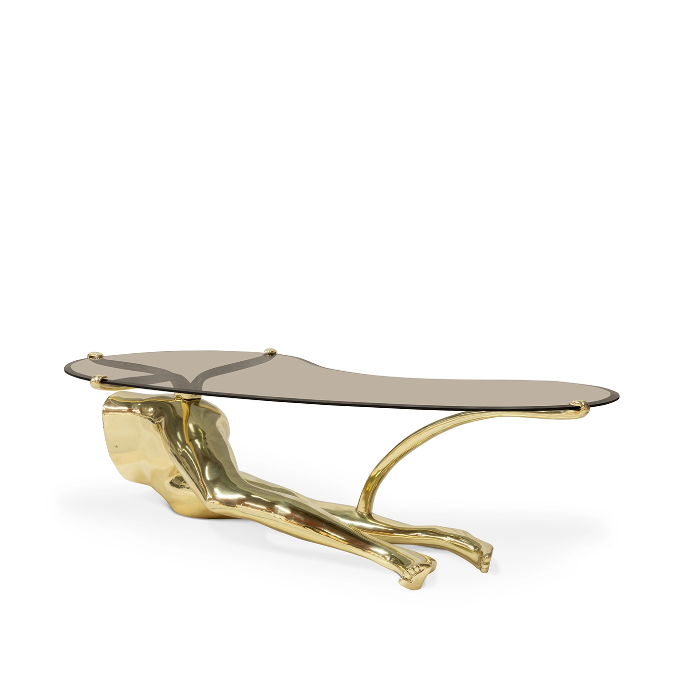 The Tabu Polished Brass Coffee Table, featuring an oval glass top on a striking brass legs-like base, is shown.
