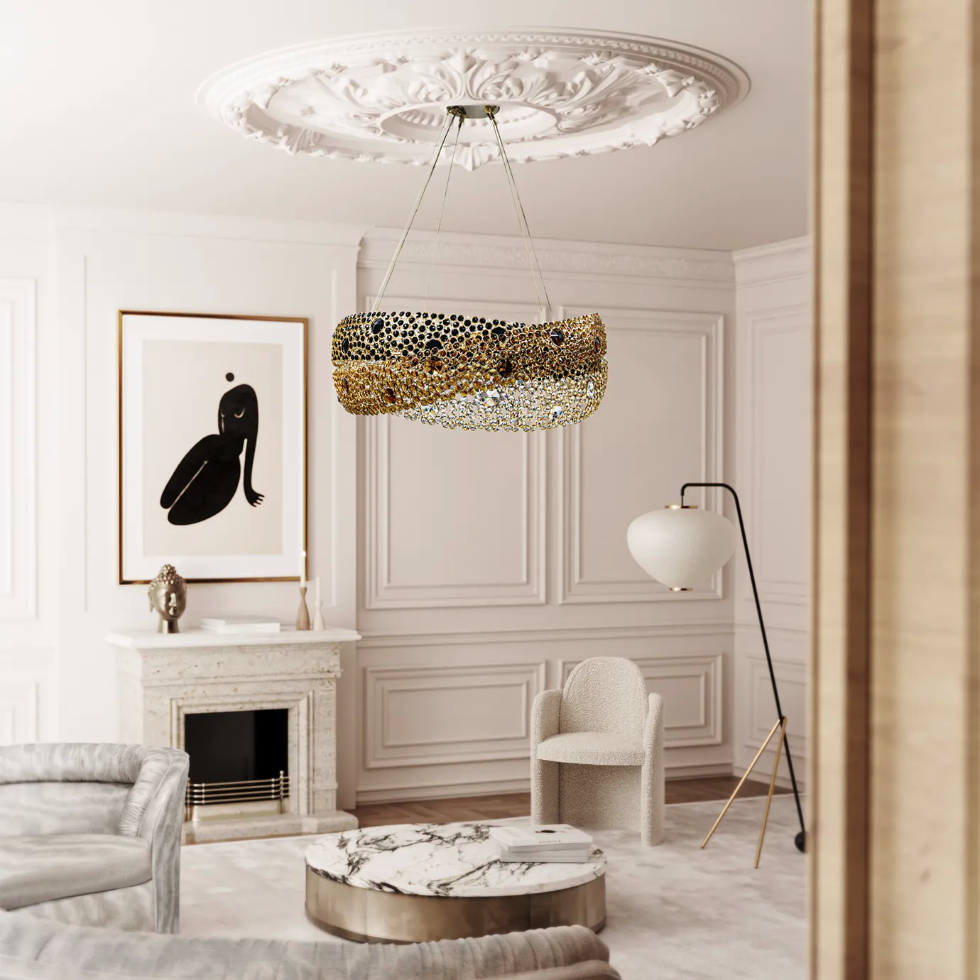 The Trinity Chandelier hangs in a chic living room with a white fireplace, marble coffee table, and abstract art.
