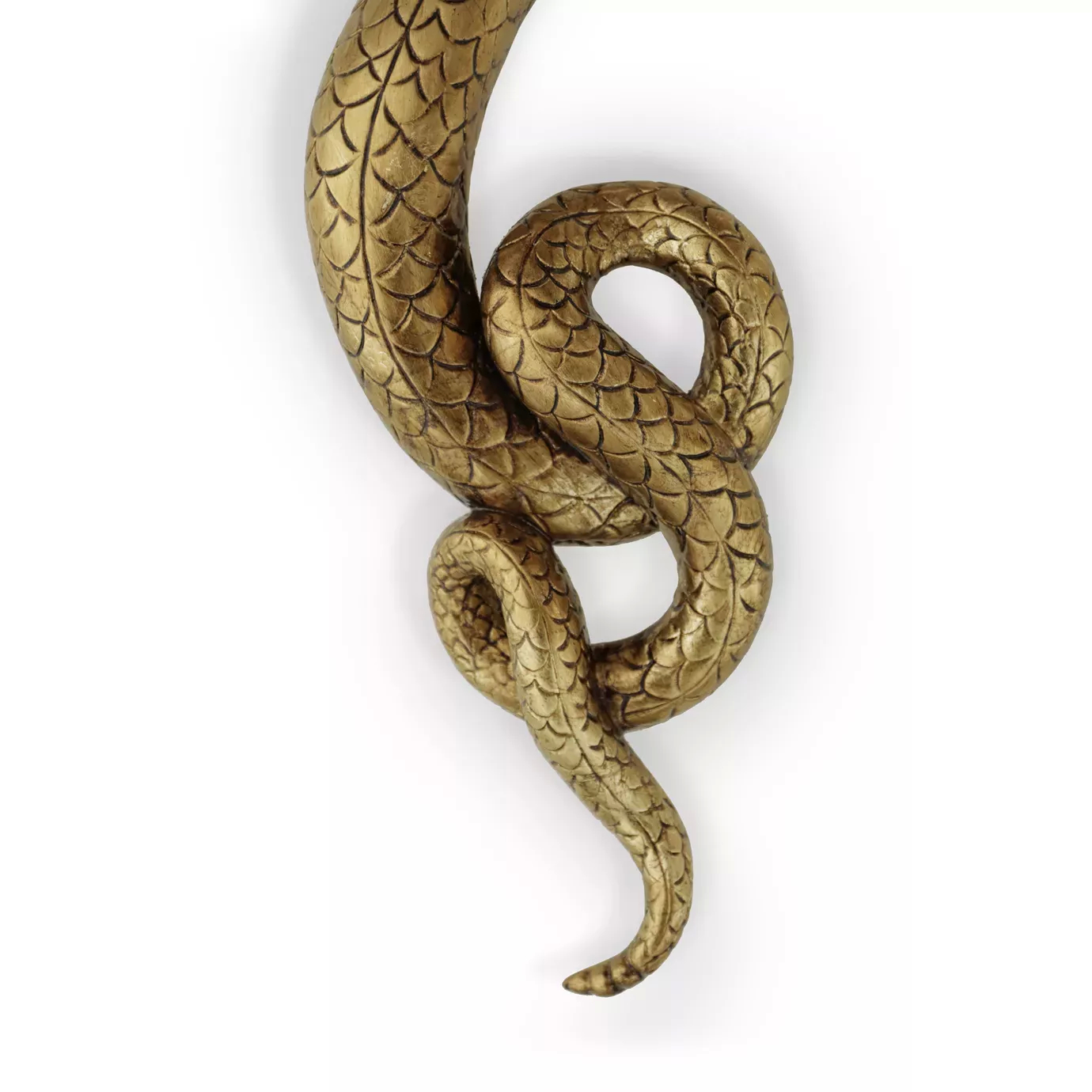 A close-up of a gold Serpentine Sconce, resembling a textured snake, curving upwards.