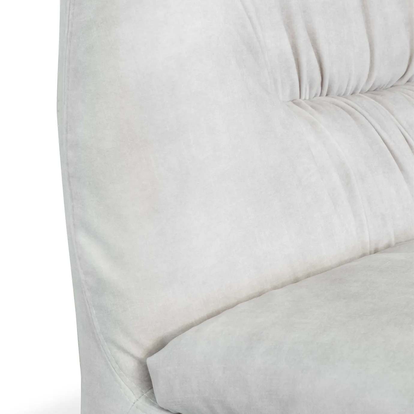 A close-up of the Cleopatra Lounge Chair's plush, light-colored upholstery, highlighting the textured pleats.