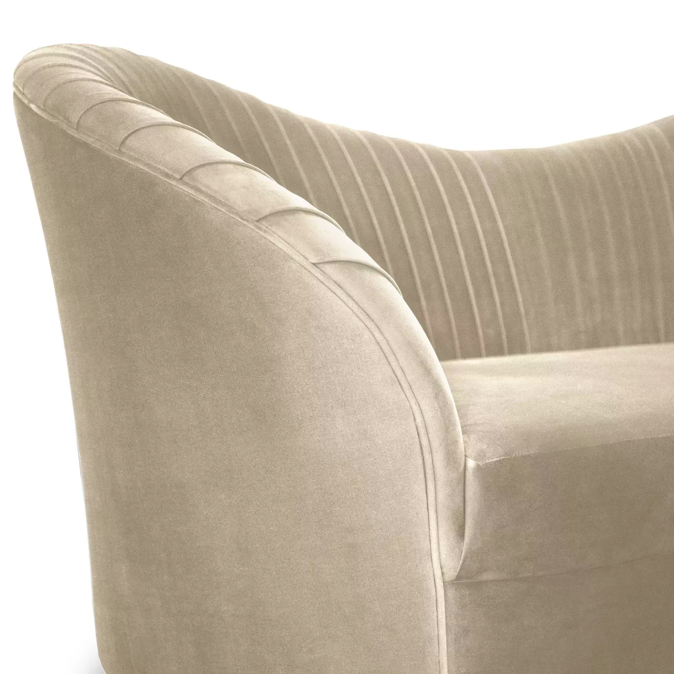 Close-up detail of a cream luxury sofa with soft velvet upholstery, fluted channel-tufted backrest, and sculptural rounded Art Deco-inspired arm.