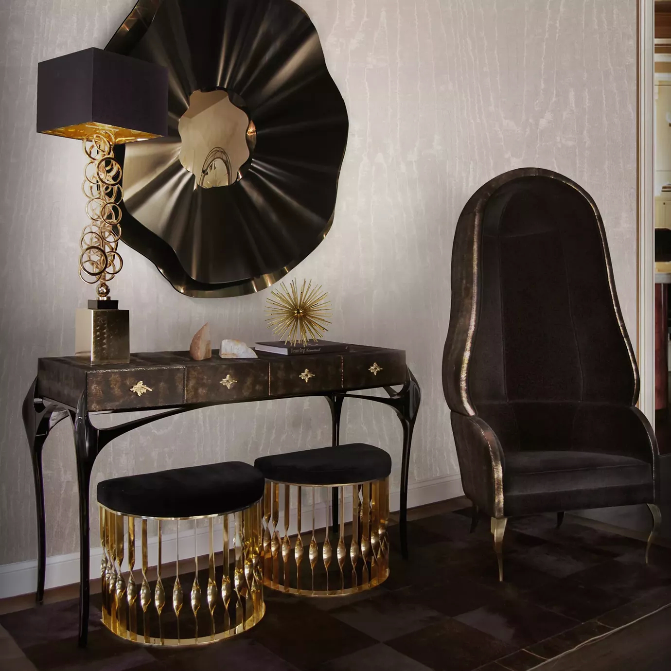 Two Mandy Stools with black velvet seats and gold bases, placed under a console table in a luxurious room.