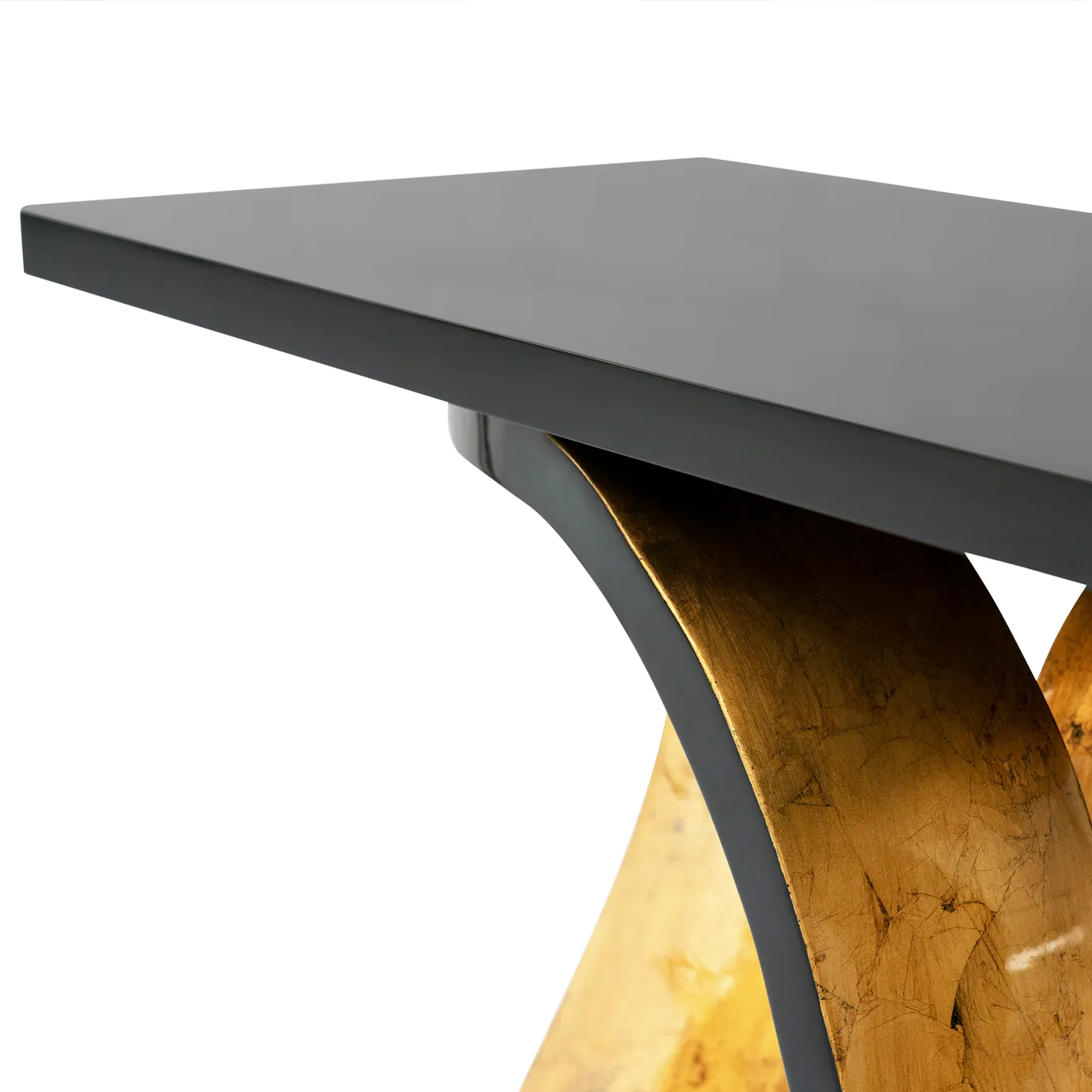 A detailed view of the Ribbon Broken Gold Leaf Console showcasing its textured gold leaf finish and black lacquer accents.