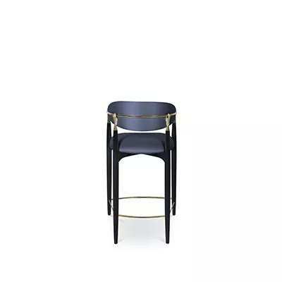 Nahéma Counter Stool: combining with its black structure, the counter stoolhas velvet upholstery in dark blue tones, with luxurious golden details.