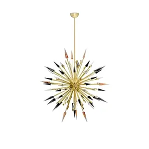 Elegant Outburst Chandelier with a sculptural explosion-like design featuring pointed details in shades of gold, black, white, and copper.