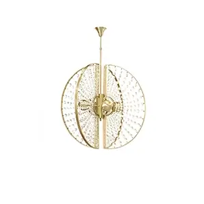 Roxy Chandelier by KOKET features four metal orbs wrapped in crystal sunbursts and a satin brass halo