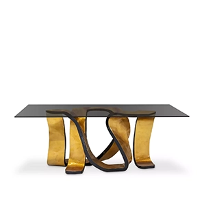 Elegant Ribbon Broken Gold Leaf Dining Table with glass top and sculptural golden base.