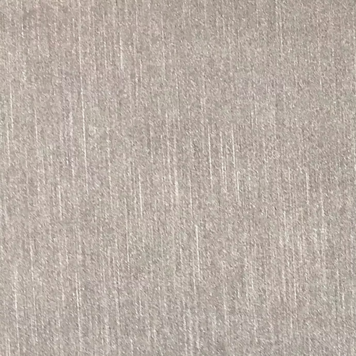 A close-up of pearl synthetic leather shows a subtly textured surface with fine, vertical striations and a soft sheen.