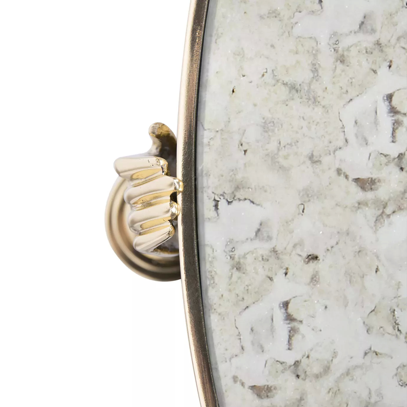 Close-up of the Gisele Side Table, featuring a gold hand detail connecting to an aged mirror top with a gold rim.