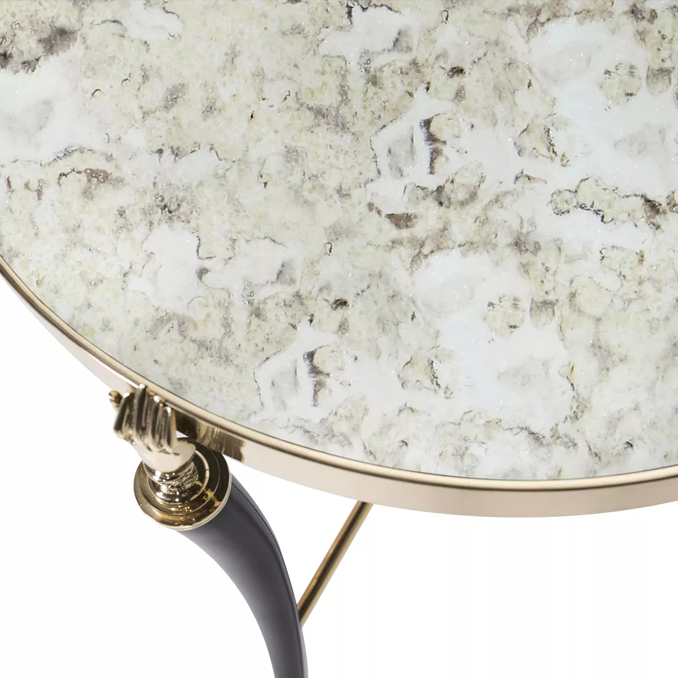 Close-up of the Gisele Side Table, showcasing an aged mirror top with a gold rim and a detailed gold hand-shaped leg joint.