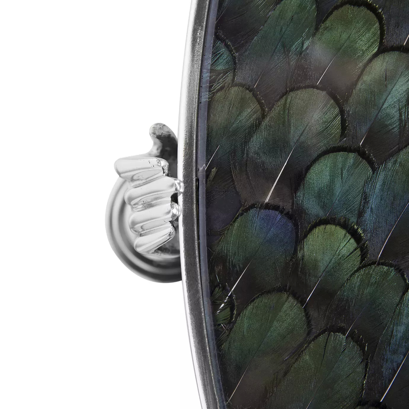 Close-up of the Gisele Side Table, showing a shiny nickel hand detail and a dark top with iridescent peacock feather patterns.