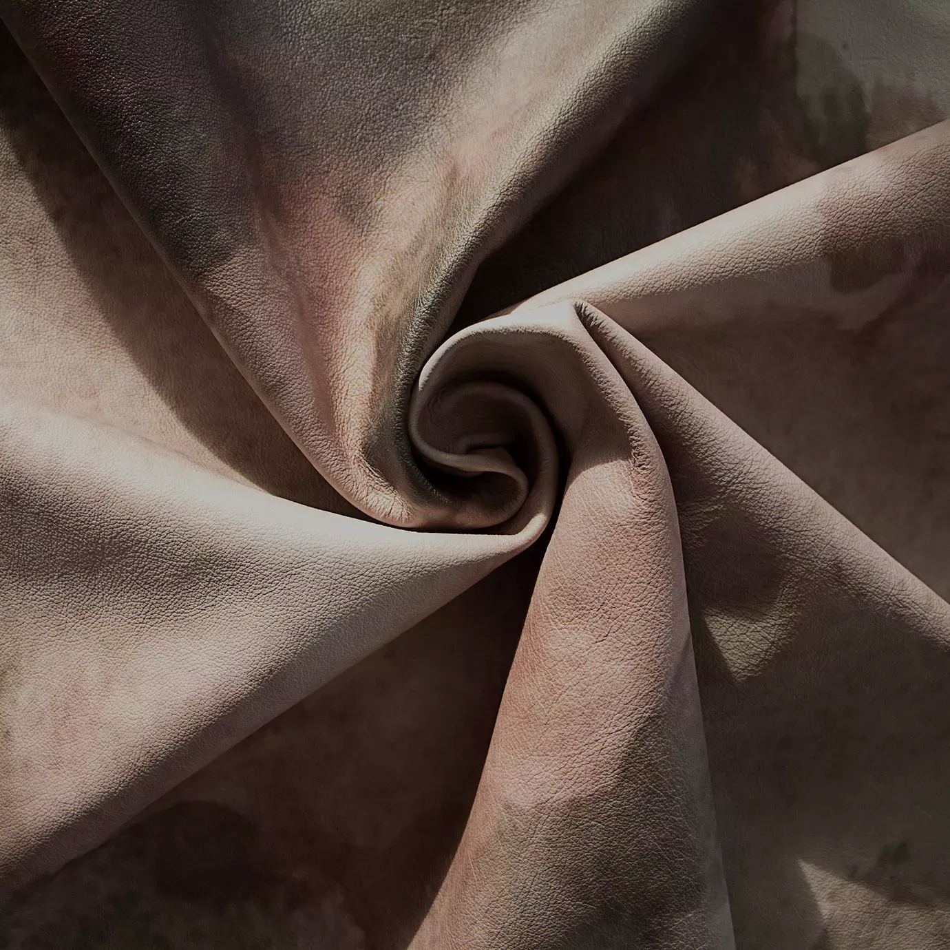 Swirled Watermark Terra Leather, showing its textured surface and blended watercolor tones of brown, beige, and soft pink.