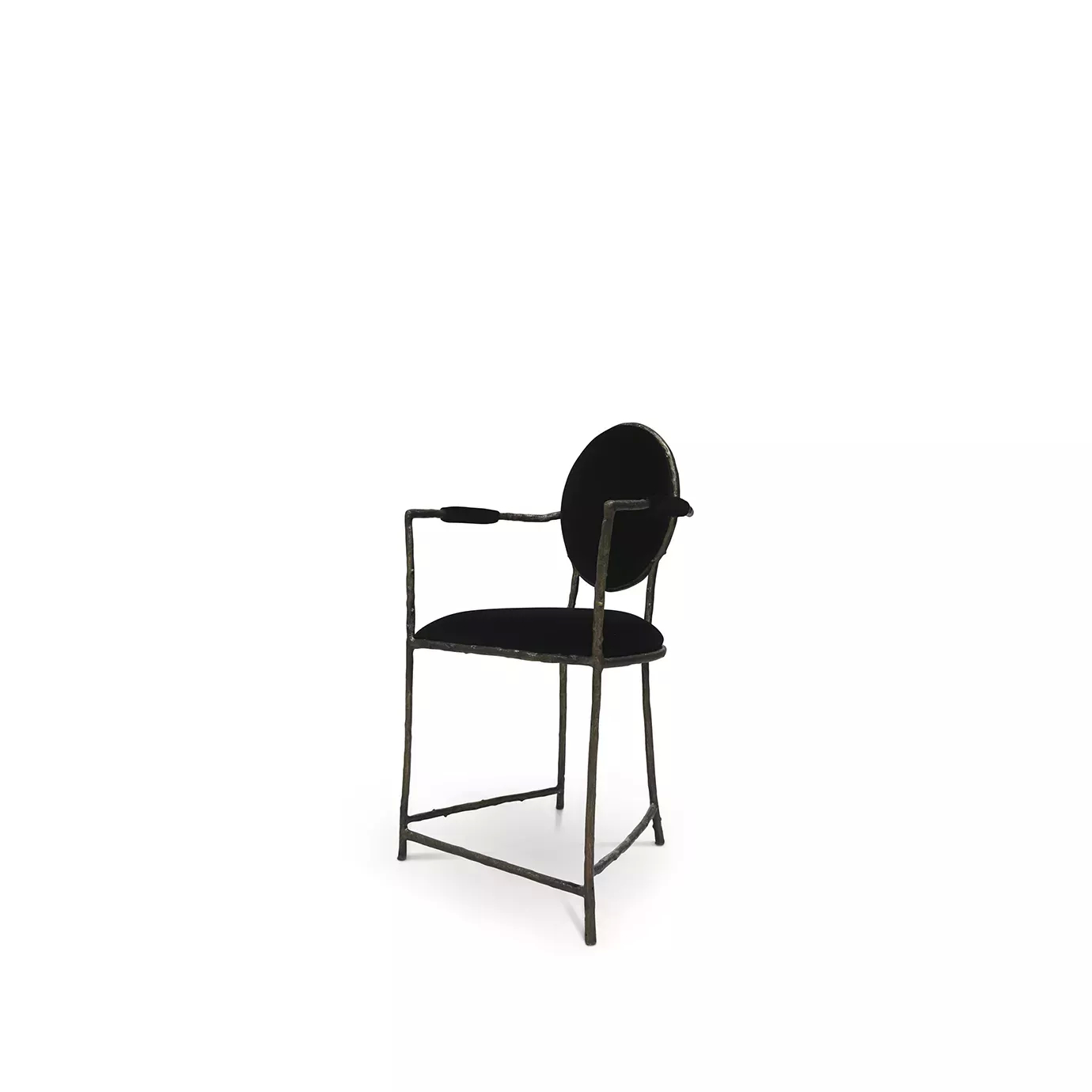 Showcasing its intricate aged brass frame that resembles branches, the Enchanted Counter Stool features a glamourous black upholstery.