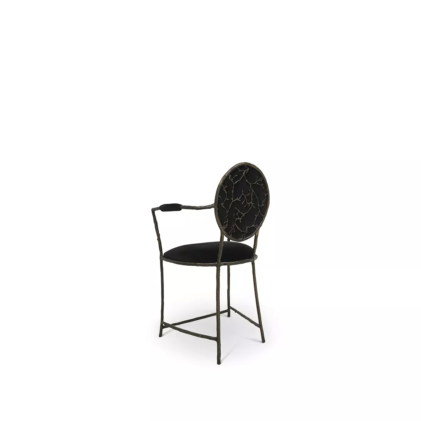 Enchanted Counter Stool: Showcasing its intricate aged brass frame that resembles branches, the dining chair also features a glamourous black upholstery.