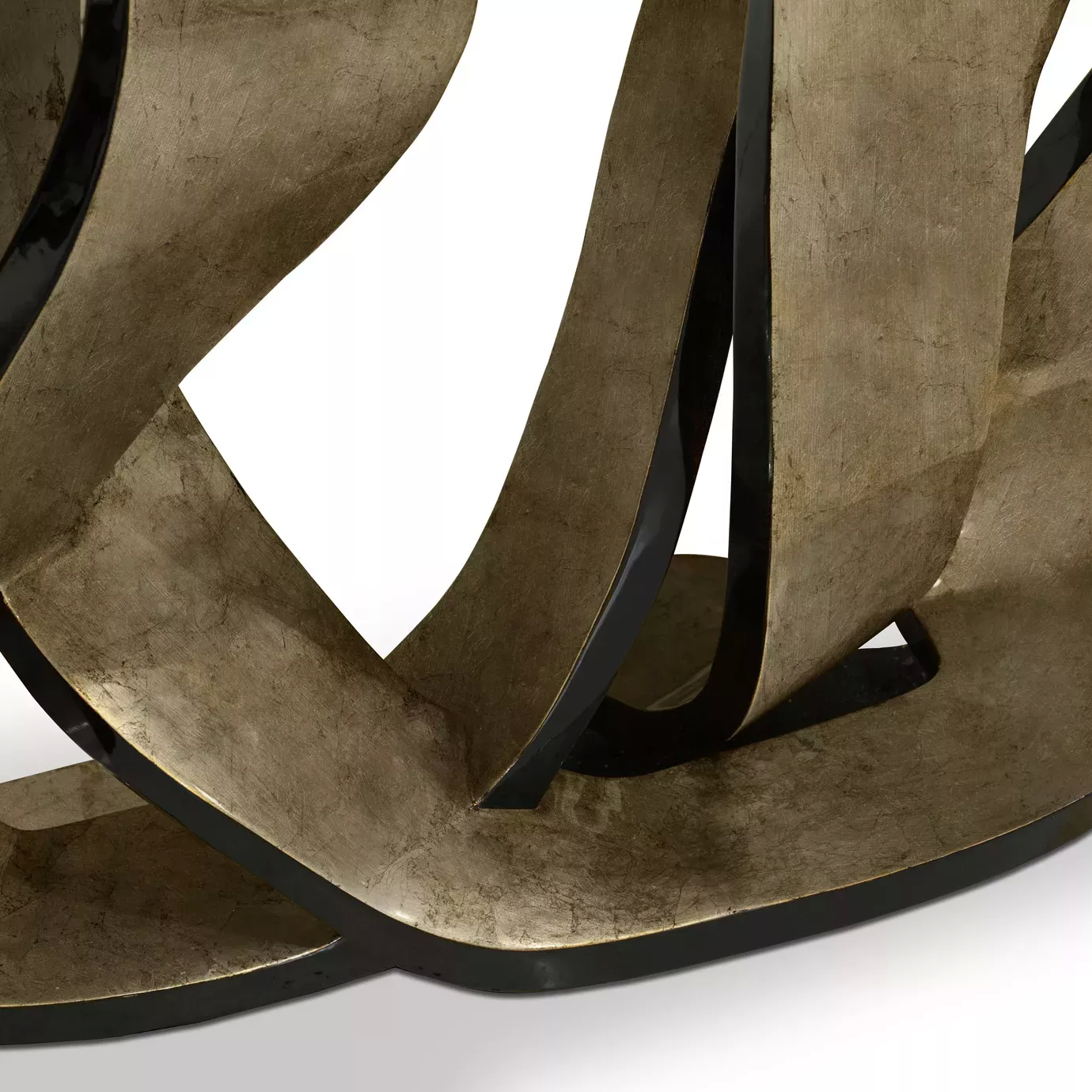 Detailed perspective of the luxurious Ribbon Broken Silver Leaf Console’s silver base, demonstrating its twists and turns.