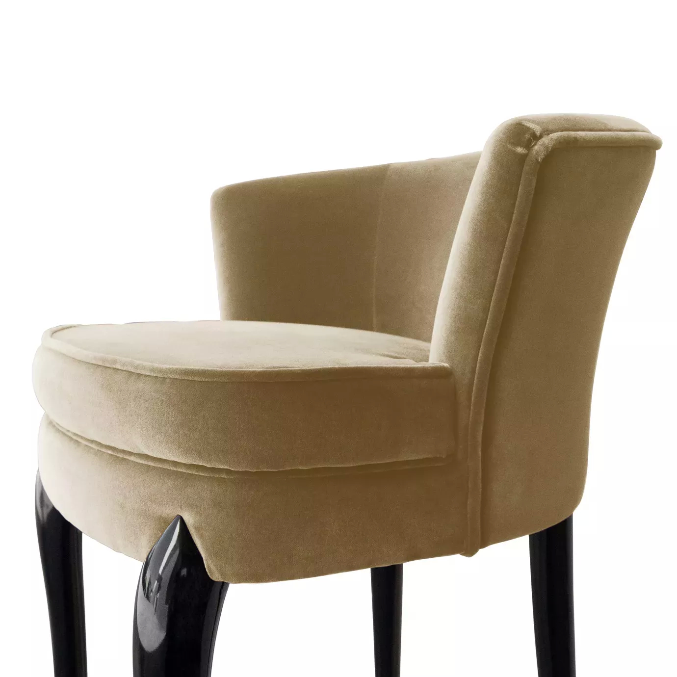 Close-up of the Délice Counter Stool showcasing the plush tan velvet upholstery and sleek black legs.