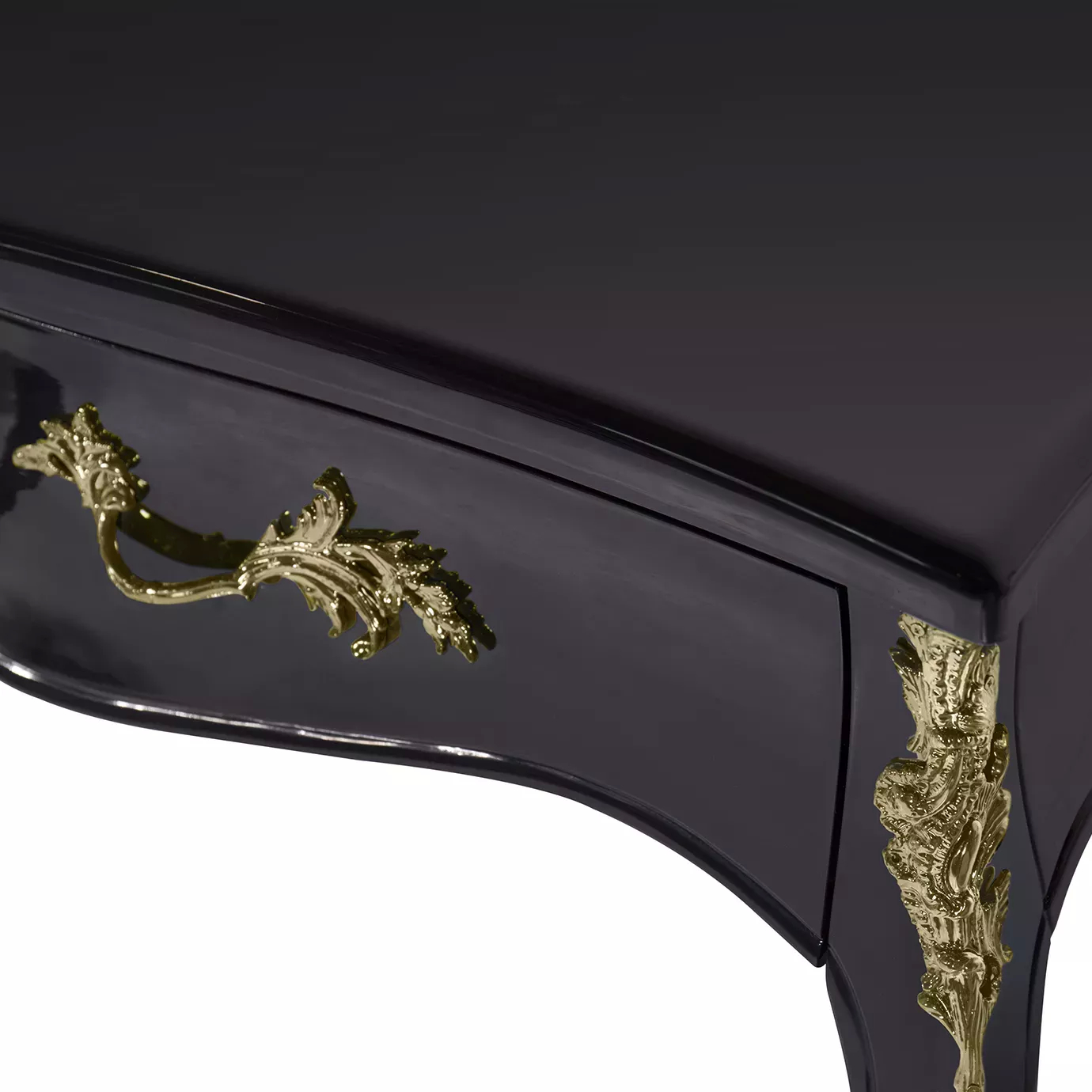 Close-up of the Exotic Lacquer Top Ormolu Desk, highlighting its glossy black finish and intricate gold embellishments.