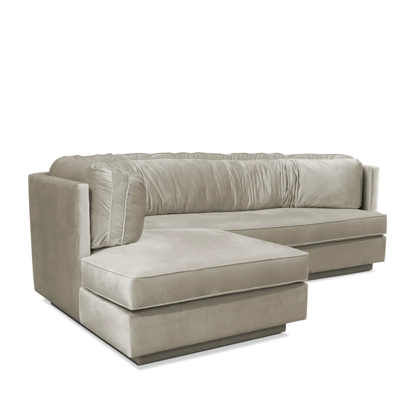 Luxurious Lisboa Sofa with a chaise, shown at a slight angle. Features elegant, ruched velvet upholstery and a sophisticated, comfortable design.
