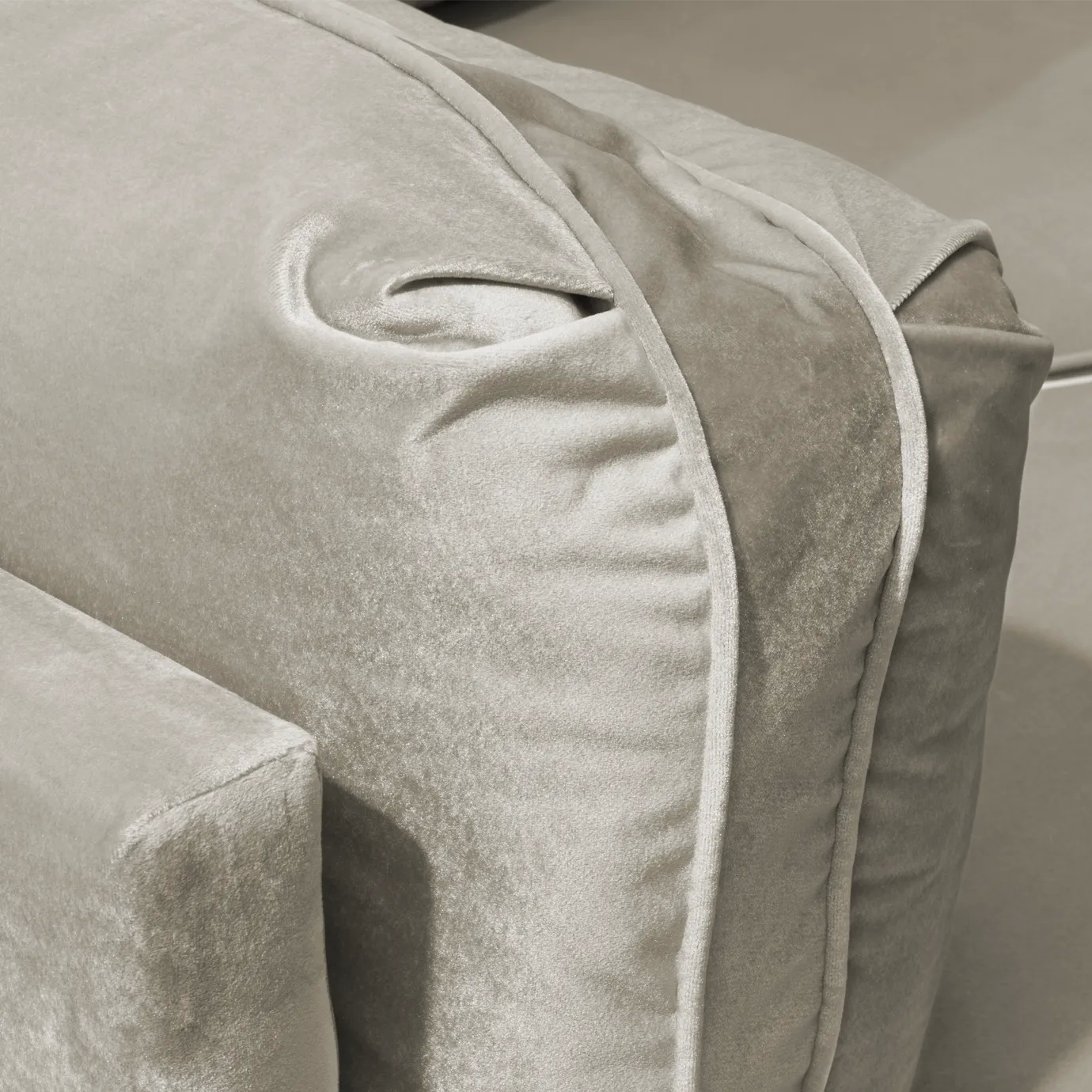 Close-up on the Lisboa Sofa's plush, ruched velvet cushions, highlighting their texture and the elegant design of the backrest.