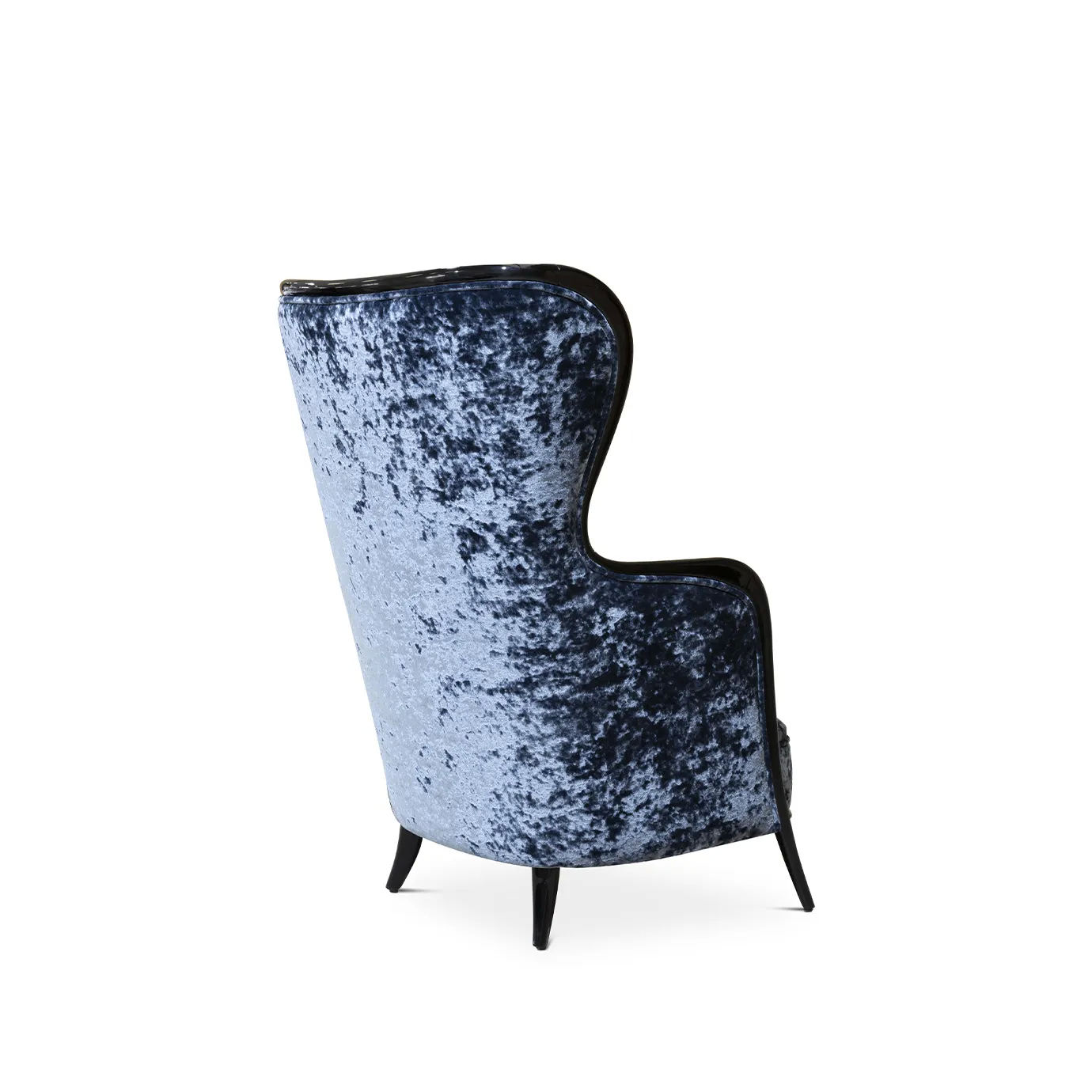 45º back view of the Nudesse Chair highlighting its high, slightly curved back, plush blue velvet, and elegant dark wood frame.