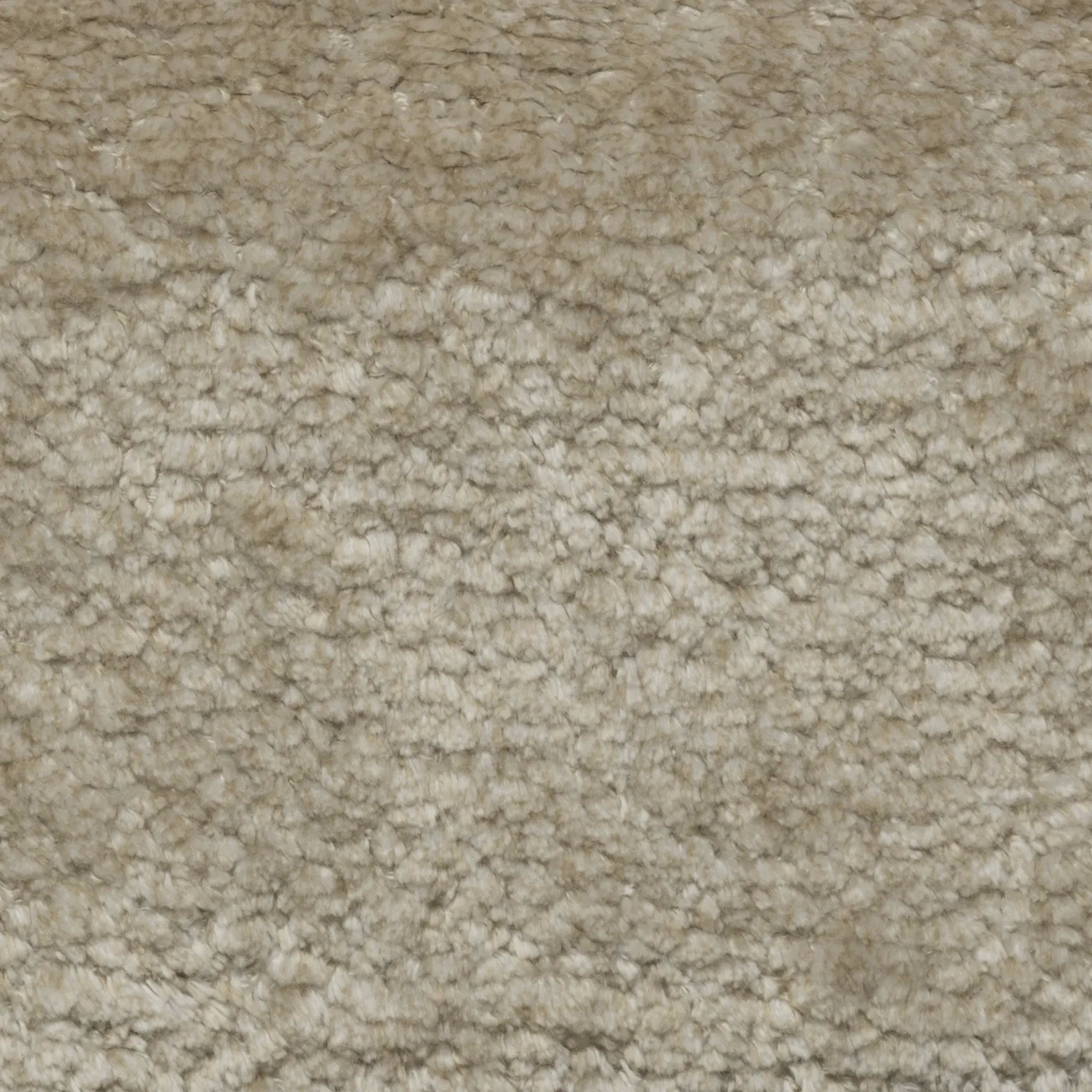 Close-up of a soft, textured, light beige fabric.