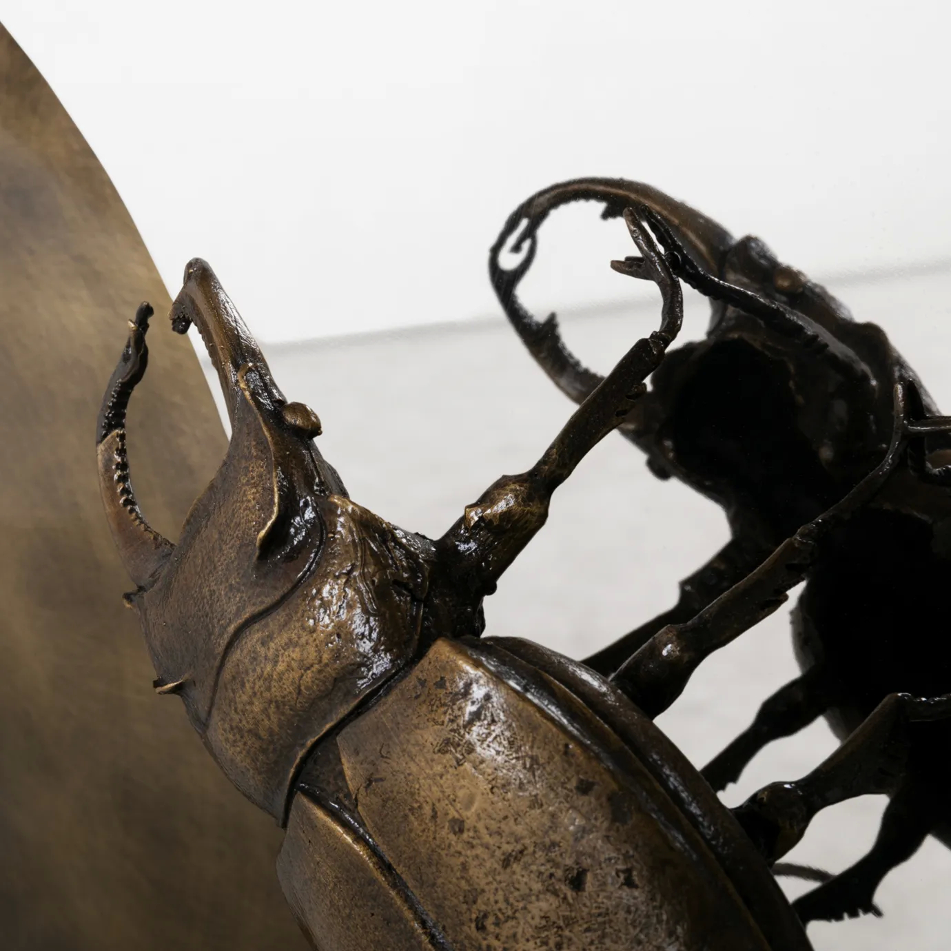 Close-up of Metamorphosis Console, highlighting intricate insect-inspired details and sculptural craftsmanship.