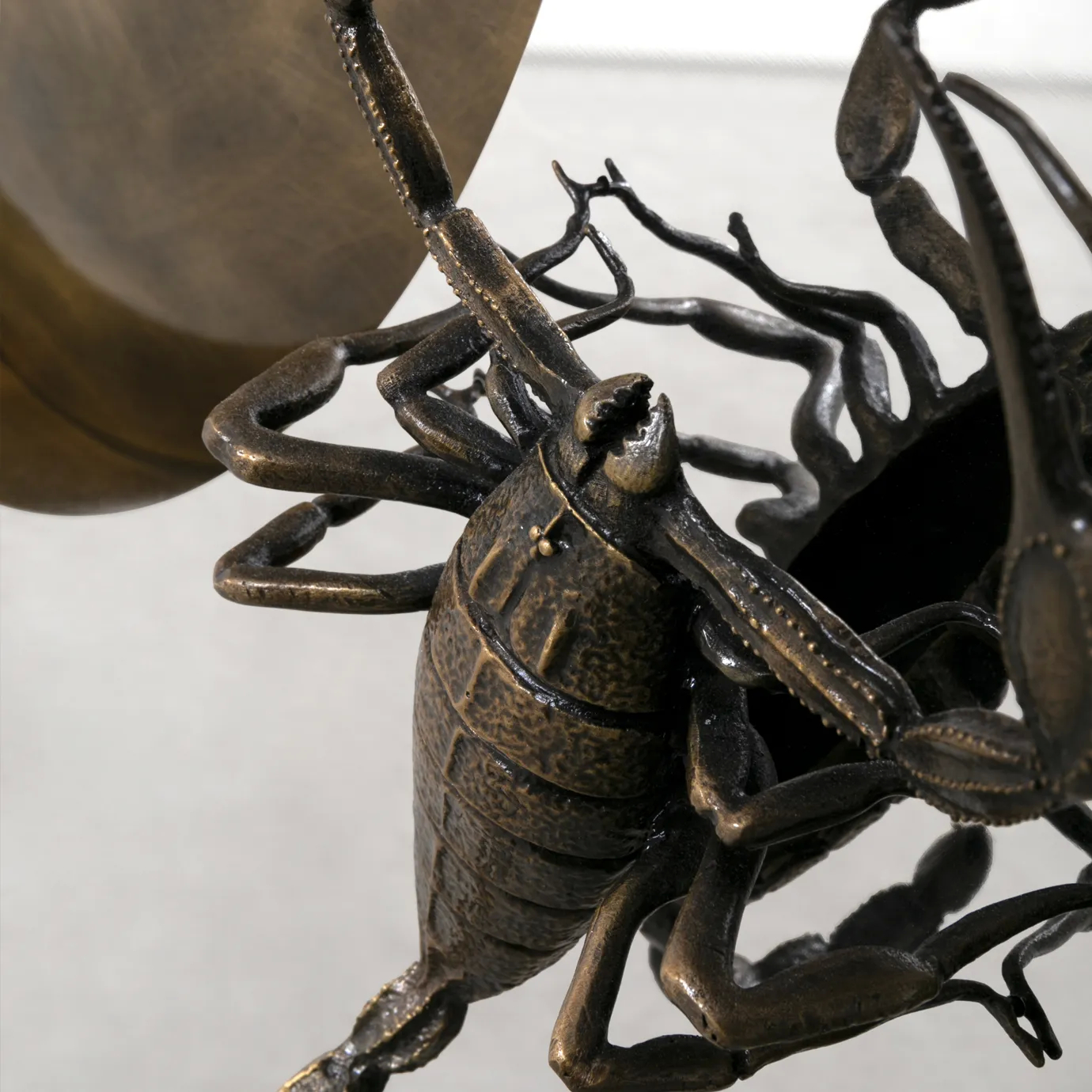 Close-up of Metamorphosis Console, highlighting the detailed scorpion-inspired design and sculptural elements.