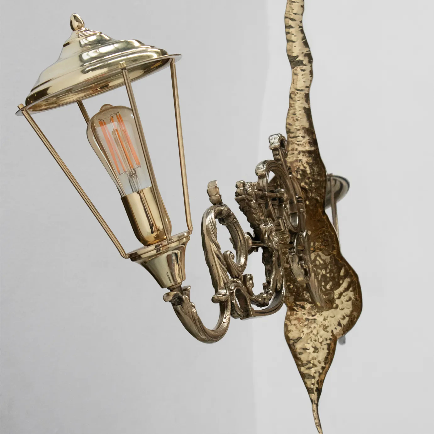Close-up of the vintage-style lamp on Lumiere Console, featuring intricate gold detailing and an elegant design.
