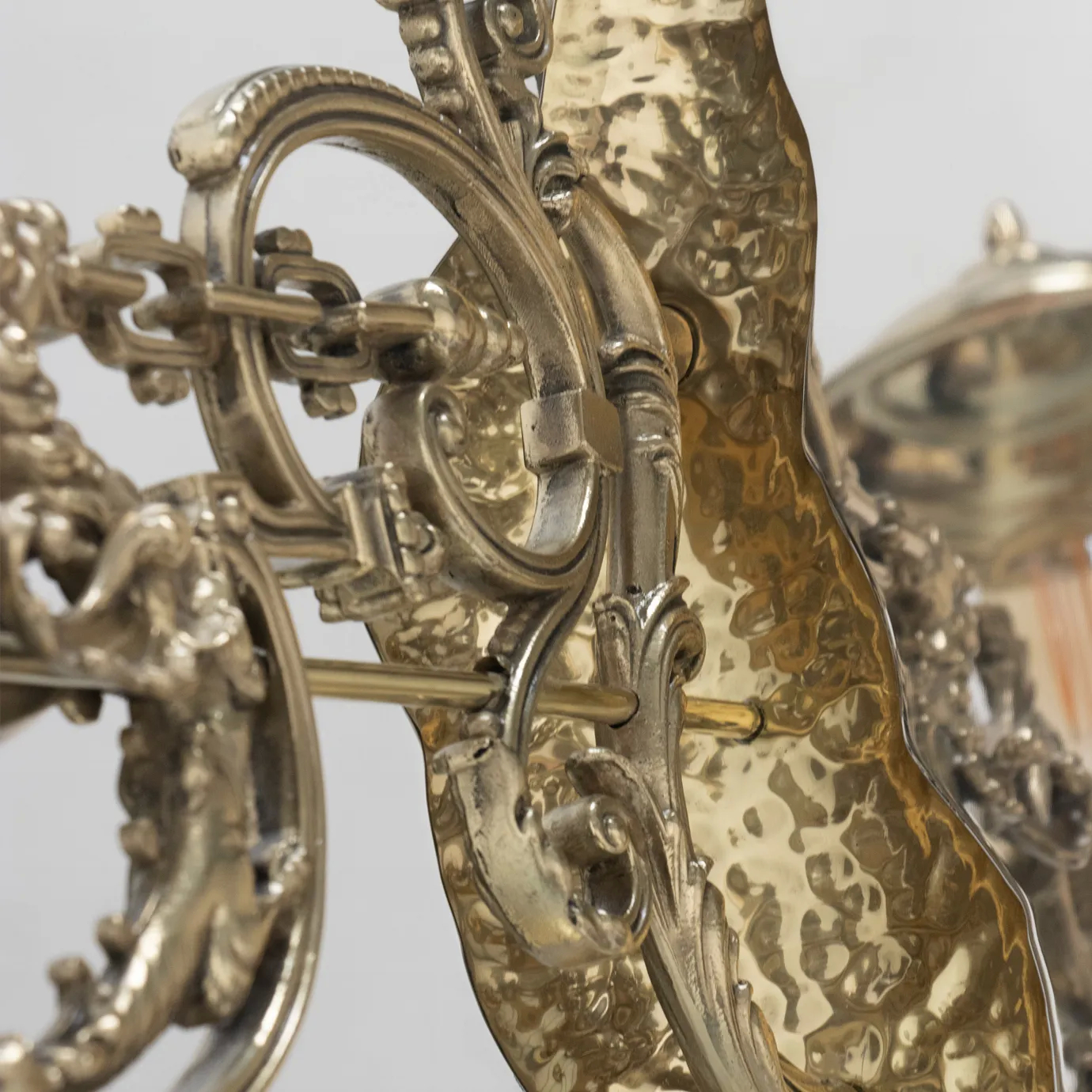 Close-up of the intricate gold detailing on the vintage-style lamp, showcasing ornate craftsmanship.